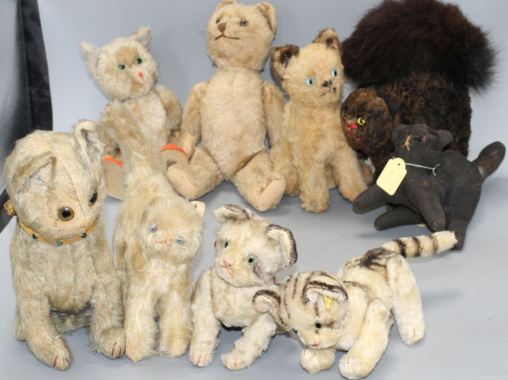 A collection of nine assorted vintage and later soft toy cats including Steiff